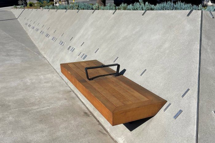 A bench along one of BBH's custom angled exterior concrete walls
