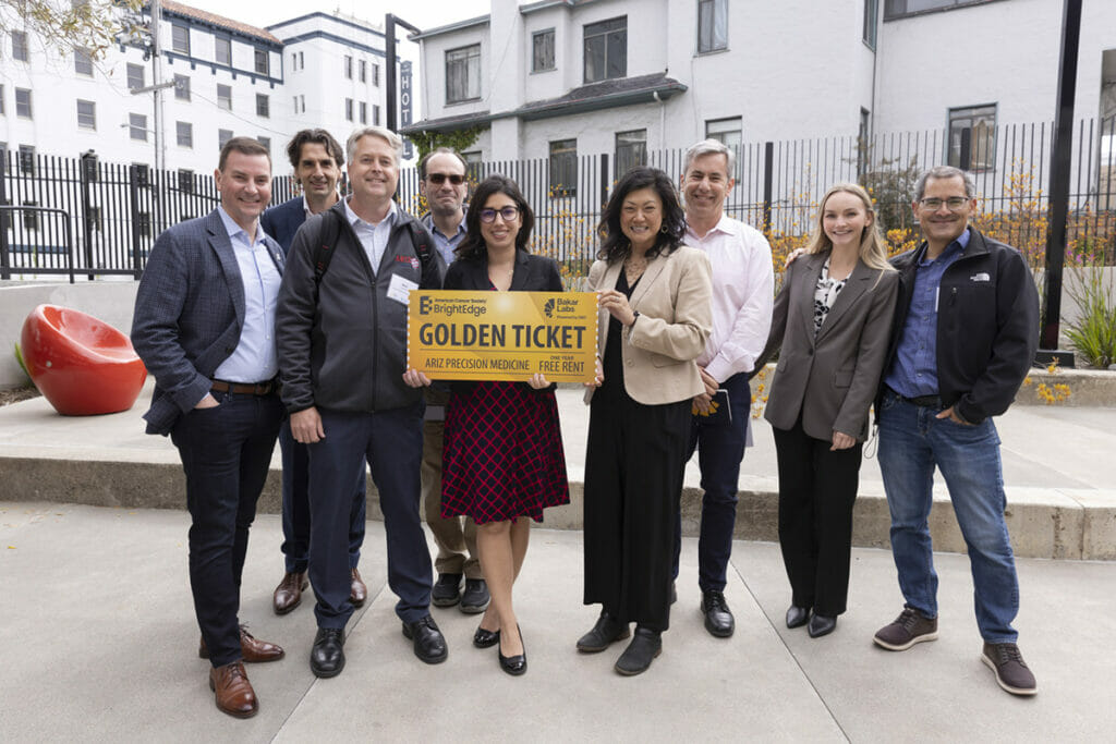 Farnaz Bakshi (center) presents the Golden Ticket to Brad Niles, CEO of ARIZ (third from left) along with the ACS BrightEdge and Bakar Labs teams.